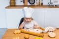 Cute little girl prepare tasty pastry, cookies and buns at home Royalty Free Stock Photo