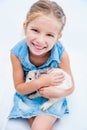 Cute little girl a white rabbit Royalty Free Stock Photo