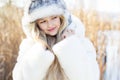 Cute little girl in winter clothes outdoors