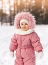 Cute little girl in a winter park on a sunny day