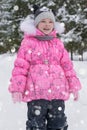 Cute little girl in winter wood