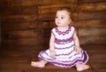 Cute little girl on a wooden background. Royalty Free Stock Photo