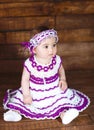 Cute little girl on a wooden background. Royalty Free Stock Photo