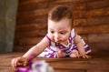 Cute little girl on a wooden background. Royalty Free Stock Photo