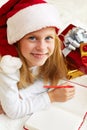 Cute little girl writes letter to Santa Claus Royalty Free Stock Photo