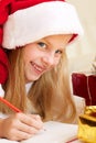 Cute little girl writes letter to Santa Claus Royalty Free Stock Photo