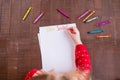 A cute little girl writes a letter to Santa Claus Royalty Free Stock Photo