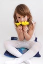Cute little girl with yellow daisies Royalty Free Stock Photo