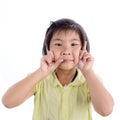 Cute little girl in yellow making funny face Royalty Free Stock Photo