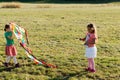 Cute little girls flying a kite