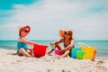 Cute little girls play with sand on summer beach Royalty Free Stock Photo