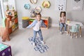 Cute little girls playing hopscotch Royalty Free Stock Photo