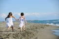 Cute little girls running on beach Royalty Free Stock Photo
