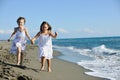 Cute little girls running on beach Royalty Free Stock Photo