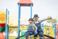 Cute little girls siblings having fun on playground outdoors on a sunny summer day. active sport leisure for kids Royalty Free Stock Photo