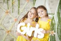 Cute little girls in spring studio