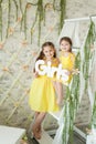 Cute little girls in spring studio