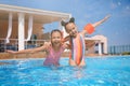 Cute little girls in swimming pool at water park Royalty Free Stock Photo