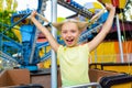 Cute little happy smiling girl riding a Carnival Royalty Free Stock Photo