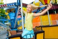 Cute little happy smiling girl riding a Carnival Royalty Free Stock Photo