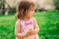 Cute little happy toddler girl portrait walking in spring or summer park Royalty Free Stock Photo