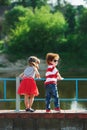 Cute little hugging children on the promenade