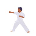Cute little karate boy wearing white uniform and belt training at martial art training practice