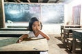 Cute a little khmer girl looking at camera in the classroom at elementary school. Koh Kong, Cambodia