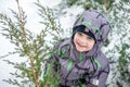 Cute little kid boy in colorful winter clothes laying down on . Active outdoors leisure with children in . Happy child. Royalty Free Stock Photo