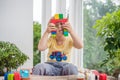 Cute little kid boy with playing with lots of colorful plastic blocks indoor. Active child having fun with building and creating o Royalty Free Stock Photo