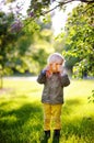 Cute little kid boy taking picture using toy photo camera Royalty Free Stock Photo