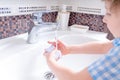 Cute Little kid boy Wash and antiseptic hands with soap. Clean and Hygiene concept. Selective focus and blur background