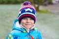 Cute little kid boy in winter clothes outdoors Royalty Free Stock Photo