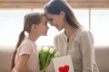 Cute little kid daughter congratulating happy mom with mothers day Royalty Free Stock Photo