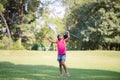 Cute little kid girl playing outdoors in the garden, Black child girl in the park Royalty Free Stock Photo