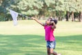 Cute little kid girl playing outdoors in the garden, Black child girl in the park Royalty Free Stock Photo