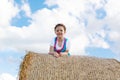 Cute little kid girl in traditional Bavarian costume in wheat field Royalty Free Stock Photo