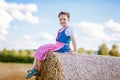 Cute little kid girl in traditional Bavarian costume in wheat field Royalty Free Stock Photo