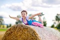 Cute little kid girl in traditional Bavarian costume in wheat field Royalty Free Stock Photo