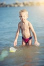 Cute little kid wearing mask and flippers for diving at sand tropical beach. Royalty Free Stock Photo