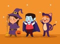 Cute little kids dressed as a cat and witch with dracula characters Royalty Free Stock Photo