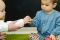 Cute little kids in nursery play with balls and smile