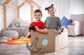 Cute little kids playing with binoculars and cardboard boat Royalty Free Stock Photo