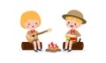 Cute little kids sitting on a log and playing guitar and bongo drums by campfire, boy scout or girl scout honor uniform