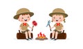 Cute little kids sitting on log and Roasting Fish and fish on campfire, boy scout or girl scout honor uniform, kids summer camp,