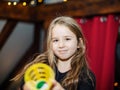 Cute little long haired girl playing games at home