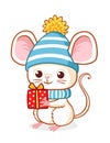 Cute little mouse in a blue Christmas hat is holding a Christmas present Royalty Free Stock Photo