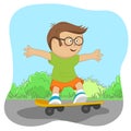 Cute little nerd boy with glasses on skateboard on road Royalty Free Stock Photo