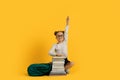 Cute Little Nerdy Schoolgirl Sitting With Pile Of Books And Raising Hand Royalty Free Stock Photo