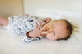 Cute little newborn baby boy lying on a changing table. Portrait of tiny new baby at home Royalty Free Stock Photo